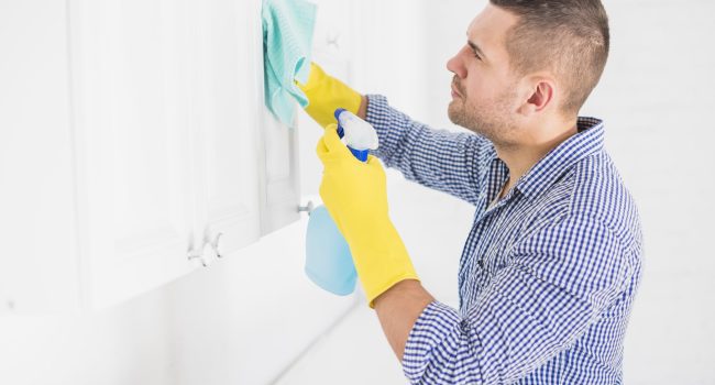 man-cleaning-his-home